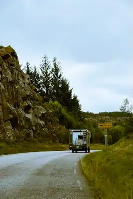A picture of a camper on the street.