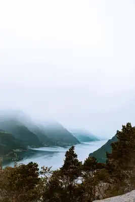 A foogy picture of mountains in norway.
